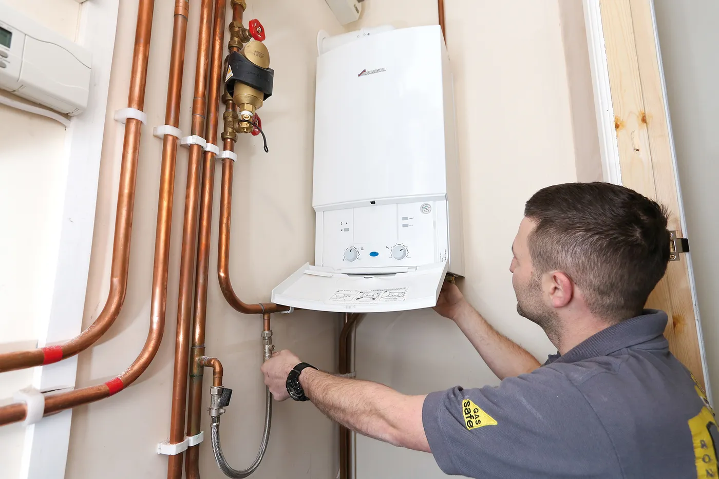 Gas Safe registered engineer servicing a Vaillant boiler in London