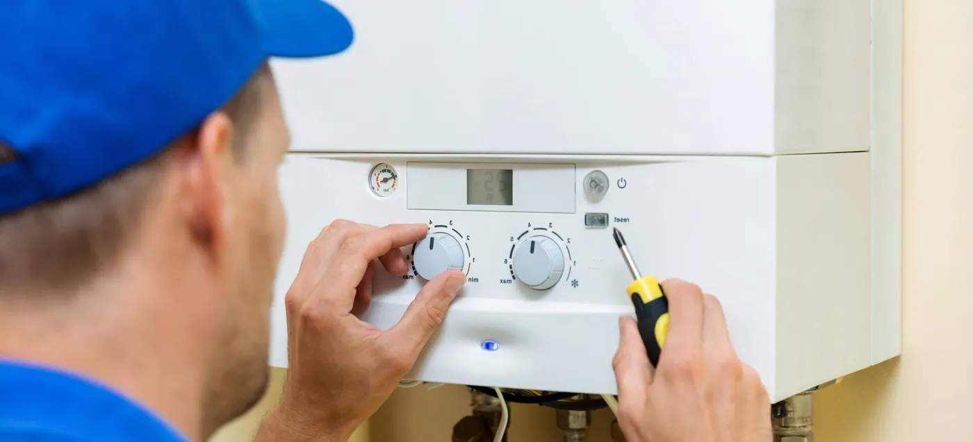 Gas Safe registered engineer servicing a Worcester Bosch boiler in London